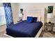 Comfortable bedroom with plush bedding, decorative pillows, side tables and lamps, offering a relaxing retreat at 456 Ocean Course Ave, Davenport, FL 33896