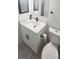 Modern bathroom with a sleek black faucet and a white toilet and sink at 4719 Miranda Cir, Orlando, FL 32818