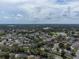 Wide aerial view of the community showcasing the neighborhood's mature trees, lakes and general surroundings at 478 N Sundance Dr, Lake Mary, FL 32746
