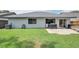 Large backyard with a well-maintained lawn, patio area, and full privacy fence at 478 N Sundance Dr, Lake Mary, FL 32746
