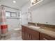 Bathroom offering granite countertops, wood cabinetry, and a shower-tub combo with tile surround at 478 N Sundance Dr, Lake Mary, FL 32746