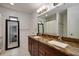 Bathroom featuring a double vanity with a granite countertop, accompanied by modern fixtures at 478 N Sundance Dr, Lake Mary, FL 32746