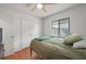 Bedroom featuring hardwood floors, ceiling fan, window, and closet with a comfy vibe at 478 N Sundance Dr, Lake Mary, FL 32746