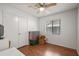Bright bedroom features a ceiling fan, a closet with wood-look floors, and natural light at 478 N Sundance Dr, Lake Mary, FL 32746