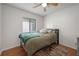 Bedroom featuring hardwood floors, ceiling fan, window, and cozy decor with a natural light at 478 N Sundance Dr, Lake Mary, FL 32746