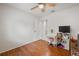 Bedroom featuring hardwood floors, fan and vanity with natural light at 478 N Sundance Dr, Lake Mary, FL 32746