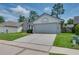 Exterior view showing a home with a two car garage and well maintained yard at 478 N Sundance Dr, Lake Mary, FL 32746