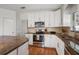 Close up of the kitchen features with stainless steel appliances and granite countertops at 478 N Sundance Dr, Lake Mary, FL 32746