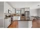 Bright kitchen featuring white cabinetry, granite countertops, stainless steel appliances, and an island at 478 N Sundance Dr, Lake Mary, FL 32746