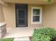 Inviting front porch with stone accents and screen door, enhancing curb appeal and functionality at 4852 Magnolia Preserve Dr, Winter Haven, FL 33880