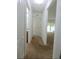 Bright hallway leading to a spacious living area, with access to the bathroom and other rooms at 4852 Magnolia Preserve Dr, Winter Haven, FL 33880