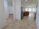 Open concept kitchen featuring stainless steel appliances and an adjoining living space at 4852 Magnolia Preserve Dr, Winter Haven, FL 33880
