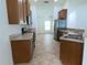 Functional kitchen with stainless steel appliances, ample counter space, and tile flooring at 4852 Magnolia Preserve Dr, Winter Haven, FL 33880