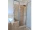 Nicely tiled glass shower with stone base at 4852 Magnolia Preserve Dr, Winter Haven, FL 33880