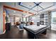 Spacious living area with game table, comfortable seating and colorful modern decor, ideal for entertaining at 5328 Teirgarten St, St Cloud, FL 34771
