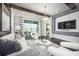 Beautifully staged living room with hardwood floors, stylish decor, and access to a covered balcony at 5328 Teirgarten St, St Cloud, FL 34771