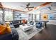 Bright, open living room featuring modern decor, a comfortable sectional sofa, and a fun game table at 5328 Teirgarten St, St Cloud, FL 34771