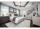 Serene main bedroom with a decorative ceiling, neutral tones, and ample natural light at 5328 Teirgarten St, St Cloud, FL 34771