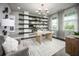 Bright office space with custom shelving, modern decor, and large windows for natural light at 5328 Teirgarten St, St Cloud, FL 34771
