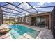 Relaxing private pool with screened enclosure and outdoor seating, perfect for enjoying sunny days and evenings at 5328 Teirgarten St, St Cloud, FL 34771