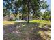 Expansive backyard with a screened-in patio area, ideal for outdoor entertaining and relaxation at 5815 England Ave, Orlando, FL 32808