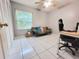 Versatile room with a neutral color palette, tiled floors, and ample closet space for various uses at 5815 England Ave, Orlando, FL 32808