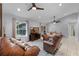Open living room with tile floor, neutral walls, recessed lights, and ceiling fan at 5815 England Ave, Orlando, FL 32808