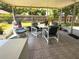 Enclosed sunroom furnished with a dining table and chairs, perfect for enjoying the backyard view at 5815 England Ave, Orlando, FL 32808