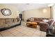 Spacious living room featuring tile floors, neutral walls, and modern furnishings at 5820 Indian Hill Rd, Orlando, FL 32808