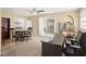 Multi-functional room with a desk, dining table, and sliding glass doors to the backyard at 5820 Indian Hill Rd, Orlando, FL 32808