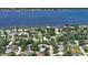 Aerial view displays property and the waterfront community located near the river at 60 Palmetto Dr, Ormond Beach, FL 32176