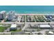 Aerial view of a coastal neighborhood with a mix of homes and apartment buildings by the beach at 60 Palmetto Dr, Ormond Beach, FL 32176