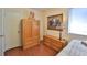 Smaller bedroom with light wood flooring, wooden closet and bright natural lighting at 60 Palmetto Dr, Ormond Beach, FL 32176