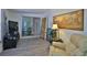 Cozy living room with gray floors, sliding glass door, and elegant decor, perfect for relaxation and entertaining at 60 Palmetto Dr, Ormond Beach, FL 32176