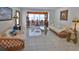 Open-concept living room with neutral tile flooring, creating a bright and airy ambiance at 60 Palmetto Dr, Ormond Beach, FL 32176