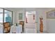 Sitting area with ornate wood chairs and table and a large storage closet at 60 Palmetto Dr, Ormond Beach, FL 32176