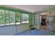 Inviting sunroom with large windows, neutral walls, and view of the backyard, ideal for relaxation at 60 Palmetto Dr, Ormond Beach, FL 32176