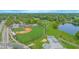 Aerial view of a baseball field next to a lake and skate park at 624 Cardinal St, Ocoee, FL 34761