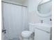 Clean bathroom with white fixtures, modern sink and toilet, and a shower with a stylish curtain at 624 Cardinal St, Ocoee, FL 34761
