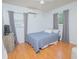 Cozy bedroom features wood floors, natural light from two windows, and gray curtains at 624 Cardinal St, Ocoee, FL 34761