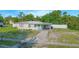 Charming single-story home with a cute blue front door and covered parking at 624 Cardinal St, Ocoee, FL 34761