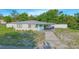 Charming single-story home with a cute blue front door and covered parking at 624 Cardinal St, Ocoee, FL 34761