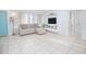 Inviting living room with tile floors, a comfortable sofa, and a modern entertainment center, creating a cozy space at 624 Cardinal St, Ocoee, FL 34761