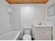 All-white bathroom featuring a tub, shower, toilet, and single sink vanity at 679 N Endeavour Dr, Winter Springs, FL 32708