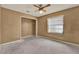 Bedroom featuring tan walls, a window, ceiling fan, and closet at 679 N Endeavour Dr, Winter Springs, FL 32708