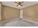Bedroom featuring tan walls, a window, and ceiling fan at 679 N Endeavour Dr, Winter Springs, FL 32708