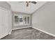 Bedroom with wood-look tile, neutral paint and many windows at 679 N Endeavour Dr, Winter Springs, FL 32708