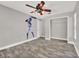A bedroom featuring wood-look flooring, a closet, ceiling fan, and baseball themed wall art at 679 N Endeavour Dr, Winter Springs, FL 32708