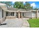 Close-up view of home entrance with stone accents and a welcoming walkway at 679 N Endeavour Dr, Winter Springs, FL 32708