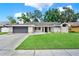Charming single-story home with a well-manicured lawn and a two-car garage at 679 N Endeavour Dr, Winter Springs, FL 32708
